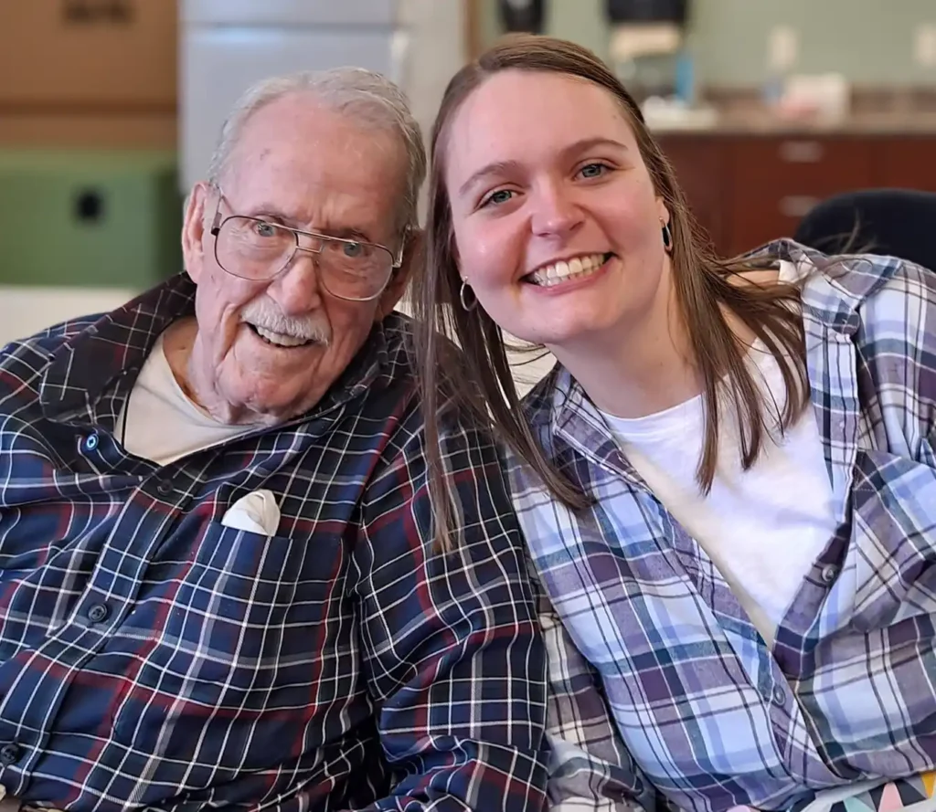 Activity team member with resident in the facility kitchen
